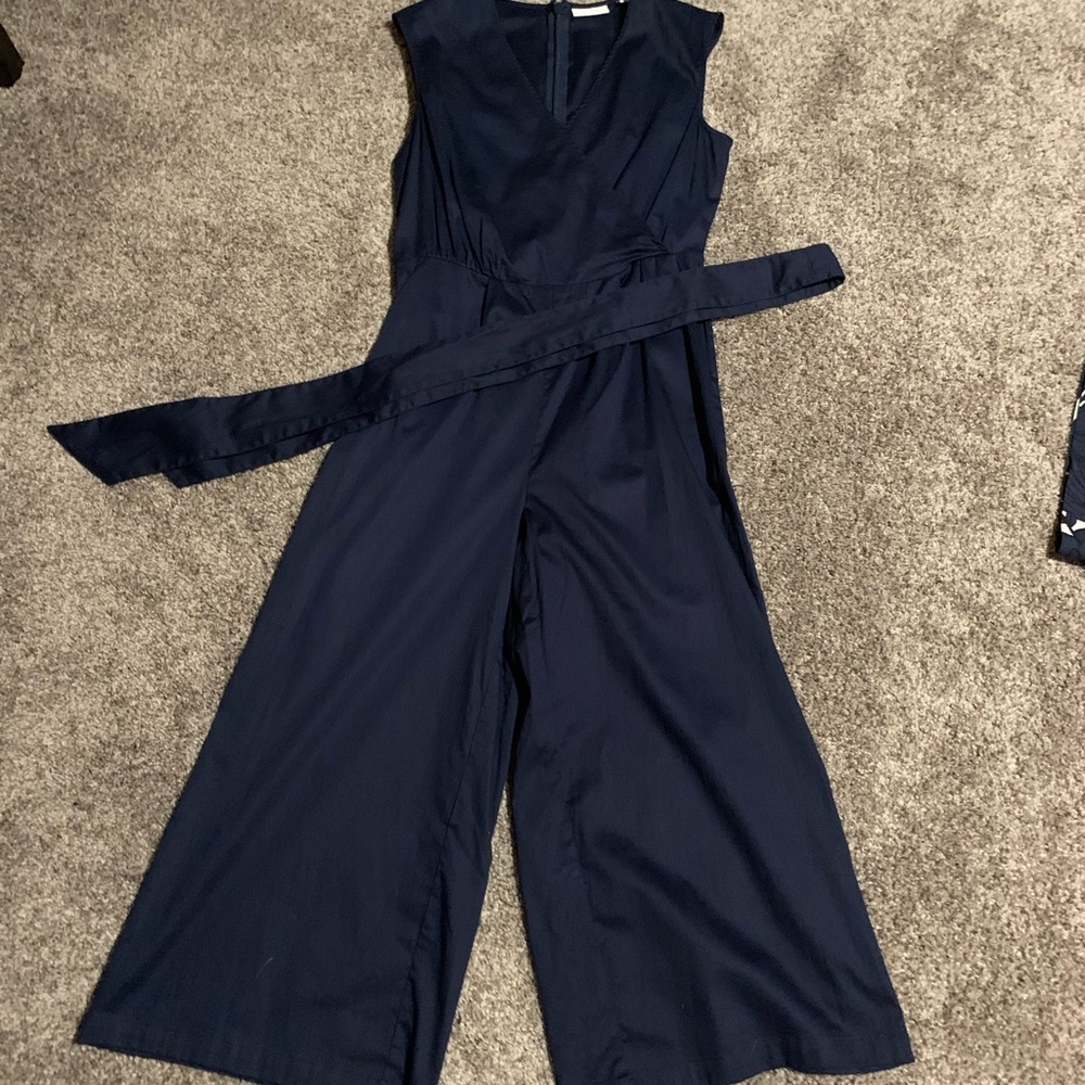Extra small navy romper. Very good cotton material with belt tie. Never worn